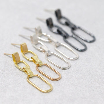Delicate yet tough flat-link handmade chain drop earrings. Available in blackened or bright sterling, 14k or 18k gold. All metals recycled.